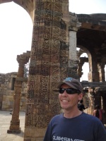 Jono in front of some very detailed carvings at Qutb Minar